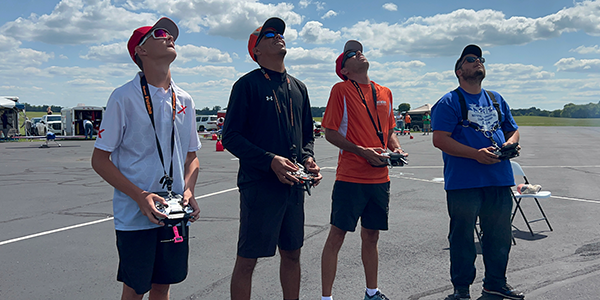 Look up to the skies and see … a four-pilot tandem flight! Pictured are (L-R) Kody, Misael Lopez, Kevin, and Johnny Gago.