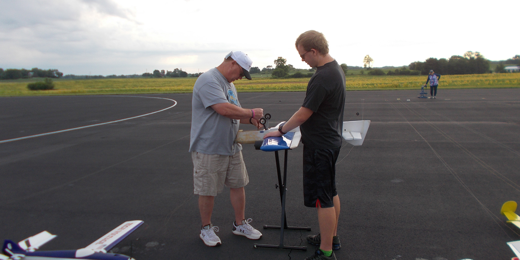 9. James Mills works on Ben’s (his son) airplane in the pits.
