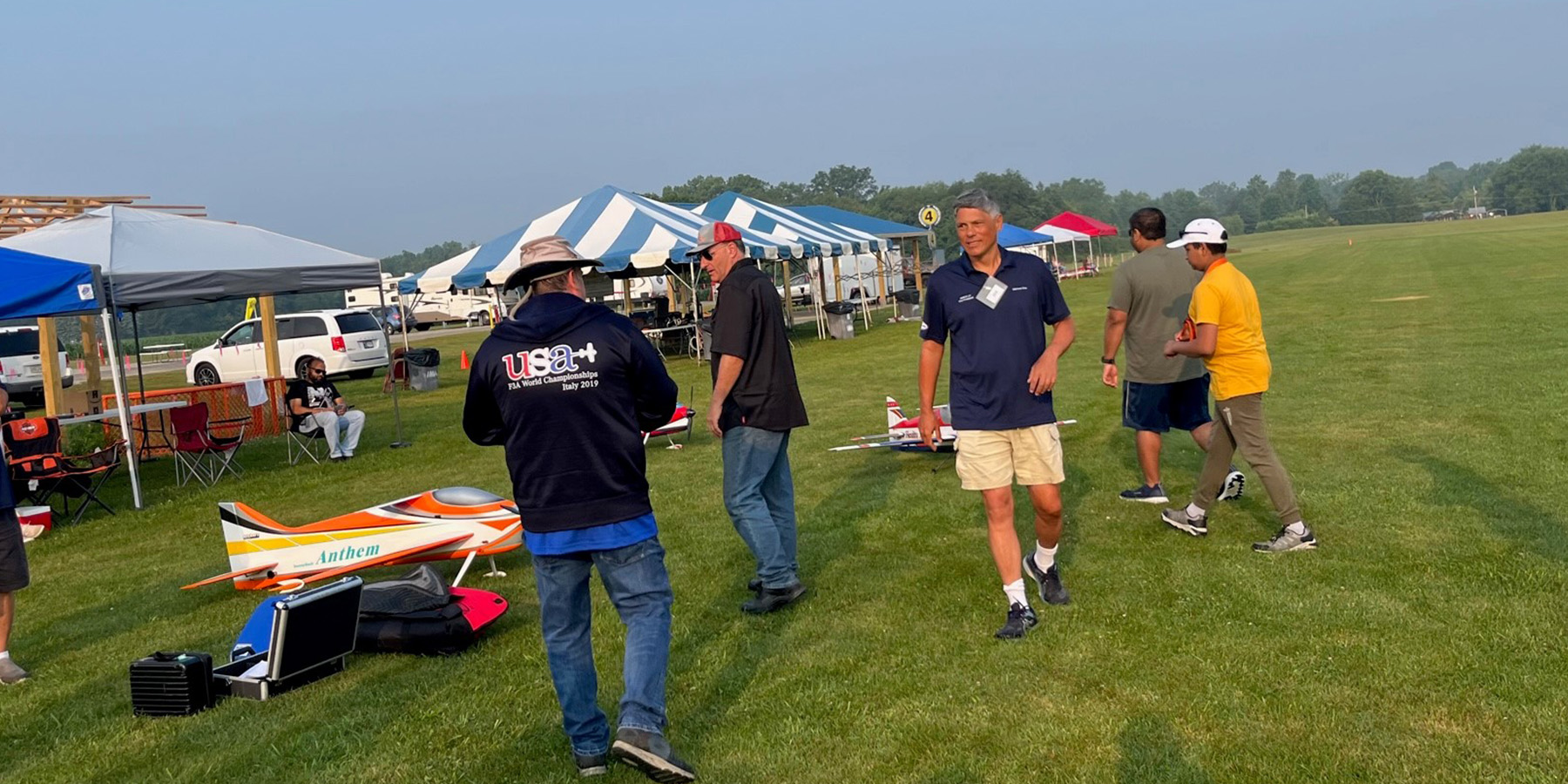 Intermediate and Sportsman pilots getting ready for a new round at Site 4. L-R: Monte, Kevin Archer (flying Intermediate), unkno