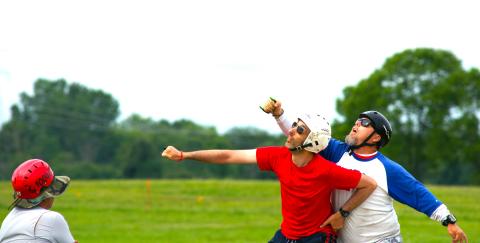 Center Marshal Arnie Delgado oversees a match between future teammates Mark Rudner (red) and Cary Minor (blue and white).