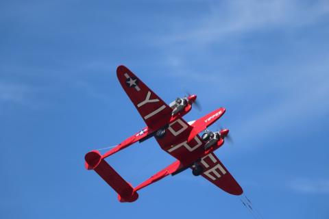 Making an overhead pass you can see the iconic markings on the Yippee P-38.