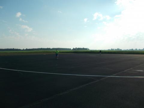 Dale Barry walks out to retrieve his son's, Derek, plane after an official flight.