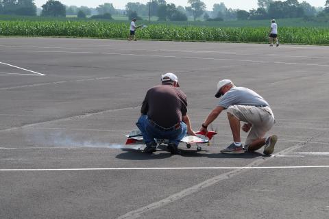 David Fitzgerald starts his engine with Brett Buck holding for an official flight.
