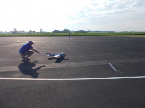 Joe Daly, AMA "CL Aerobatics" columnist launches a plane during an official.