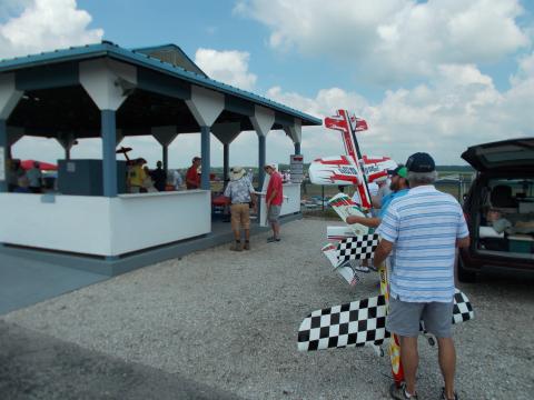 Pilots get in line to present their planes at the pavilion.